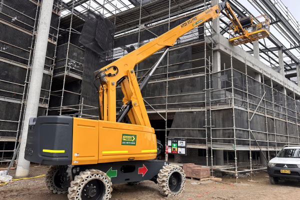 Boom lift reaching over obstacles